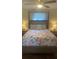 Charming bedroom with a four-poster bed, floral bedding, and bedside lamps on nightstands at 2235 20Th St S, St Petersburg, FL 33712