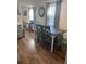 Dining area featuring wood floors, a table with seating, and natural light from the windows at 2235 20Th St S, St Petersburg, FL 33712