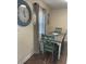 Dining area with seating for four, wooden table, and natural light from the window at 2235 20Th St S, St Petersburg, FL 33712