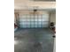 Spacious garage interior with concrete floor, offering ample storage and parking space at 2235 20Th St S, St Petersburg, FL 33712
