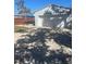 Detached garage with wide driveway and patio, offering convenient parking and outdoor space at 2235 20Th St S, St Petersburg, FL 33712
