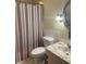 Neat bathroom with tiled shower/tub combo, updated fixtures, and neutral decor at 2700 Bayshore Blvd # 2308, Dunedin, FL 34698