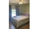Cozy bedroom with a comfortable bed, soft lighting, and a view of the outdoors at 2700 Bayshore Blvd # 2308, Dunedin, FL 34698