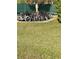 Outdoor bicycle rack with a variety of bicycles parked on the grass near a green fence at 2700 Bayshore Blvd # 2308, Dunedin, FL 34698