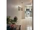 Hallway leading into a kitchen with white appliances and tiled floors at 2700 Bayshore Blvd # 2308, Dunedin, FL 34698
