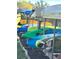 View of row of colorful kayaks on racks, ready for outdoor water adventures at 2700 Bayshore Blvd # 2308, Dunedin, FL 34698
