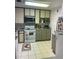 Functional kitchen with modern microwave, ample cabinet space, and light countertops at 2700 Bayshore Blvd # 2308, Dunedin, FL 34698