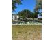Community recreation area featuring shuffleboard courts surrounded by mature trees at 2700 Bayshore Blvd # 2308, Dunedin, FL 34698