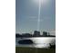 Scenic water view featuring a boat, calm water, and buildings in the distance at 2700 Bayshore Blvd # 2308, Dunedin, FL 34698