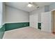 Bedroom with closet, a window, and light neutral carpet at 3904 Executive Cir, Plant City, FL 33566