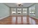 Empty living room with wood floors with lots of natural lighting, ceiling fan, and neutral paint at 3904 Executive Cir, Plant City, FL 33566