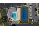 Aerial view of community amenities including pool, tennis courts, shuffleboard, and parking at 3934 37Th S St # 36, St Petersburg, FL 33711