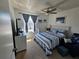 Bright bedroom features a ceiling fan, and coastal-themed decor at 3934 37Th S St # 36, St Petersburg, FL 33711