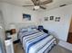 Cozy bedroom showcasing a ceiling fan and nautical-themed decor at 3934 37Th S St # 36, St Petersburg, FL 33711