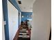 Bedroom entrance with blue walls and a view of the bed and window at 3934 37Th S St # 36, St Petersburg, FL 33711