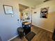 Bright kitchen featuring wood-look flooring, a pass-through window, and charming decor at 3934 37Th S St # 36, St Petersburg, FL 33711