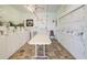 Bright laundry room with multiple washers, folding table, and tiled floors at 3934 37Th S St # 36, St Petersburg, FL 33711