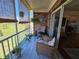 Charming screened patio featuring brick accents, tile floors, and comfortable seating at 3934 37Th S St # 36, St Petersburg, FL 33711