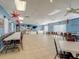 Spacious recreation room with tables, chairs, ceiling fans, and patriotic decor at 3934 37Th S St # 36, St Petersburg, FL 33711
