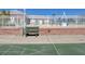 Shuffleboard court with bench seating by a white fence and brick wall at 3934 37Th S St # 36, St Petersburg, FL 33711