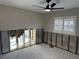 Spacious room with exposed concrete block walls, and a window with shutter blinds at 3934 Huntington Ne St, St Petersburg, FL 33703