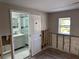 Bedroom area showing a renovated bathroom and exposed walls at 3934 Huntington Ne St, St Petersburg, FL 33703