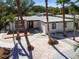Aesthetic home exterior showing a landscaped front yard with palm trees, a deck, and a modern entryway at 3934 Huntington Ne St, St Petersburg, FL 33703