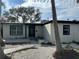 Front exterior displaying fresh paint, clean sidewalk and rock landscaping at 3934 Huntington Ne St, St Petersburg, FL 33703