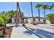 Charming single story home featuring a xeriscape front yard with mature palm trees and a concrete driveway at 3934 Huntington Ne St, St Petersburg, FL 33703