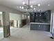Kitchen/Living room view with a large island, stainless steel appliances, and modern cabinets at 3934 Huntington Ne St, St Petersburg, FL 33703