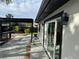 The home's patio area, showcasing a modern pergola and sliding glass doors at 3934 Huntington Ne St, St Petersburg, FL 33703