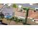 A house with a large backyard with mature trees, surrounded by neighboring homes and a community pool at 4313 Brooke Dr, Valrico, FL 33594