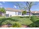 Well-maintained backyard with lush greenery, mature trees, and an access door to the house at 4313 Brooke Dr, Valrico, FL 33594