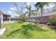 Backyard features manicured lawn, landscaping, and a new privacy fence at 4313 Brooke Dr, Valrico, FL 33594