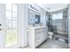 Modern bathroom with glass shower, gray vanity and new fixtures, and a toilet at 4313 Brooke Dr, Valrico, FL 33594