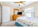 Bedroom features ceiling fan, carpet, and dresser with television at 4313 Brooke Dr, Valrico, FL 33594