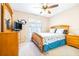 Cozy bedroom features ceiling fan and carpet at 4313 Brooke Dr, Valrico, FL 33594