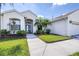 Inviting single-story home featuring tropical landscaping, well-maintained lawn, and a welcoming entrance at 4313 Brooke Dr, Valrico, FL 33594