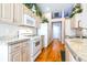 Well-lit kitchen with modern appliances, a stylish countertop, and hardwood flooring at 4313 Brooke Dr, Valrico, FL 33594