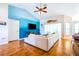Bright living room with vaulted ceilings, hardwood floors, and a blue accent wall at 4313 Brooke Dr, Valrico, FL 33594