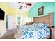 Beautifully lit bedroom boasting colorful walls, neutral furniture, and a carpeted floor at 4313 Brooke Dr, Valrico, FL 33594