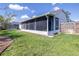 Spacious screened patio and lush green yard enhance this home's outdoor living appeal at 4313 Brooke Dr, Valrico, FL 33594