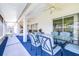 Covered lanai with outdoor dining set, ceiling fans, and access to the backyard at 4313 Brooke Dr, Valrico, FL 33594