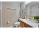 Neutral bathroom offers a modern vanity, toilet, mirror, and walk-in shower with subway tile at 4350 Talco Ave, Spring Hill, FL 34609