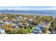 Stunning aerial view showcases the property's location near the water, surrounded by lush greenery in a desirable neighborhood at 4603 S Bartlett St, Tampa, FL 33611