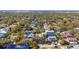 Aerial view showcases the property surrounded by a neighborhood of lush trees, and established landscaping at 4603 S Bartlett St, Tampa, FL 33611