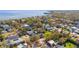 Panoramic aerial view shows the property nestled among mature trees with peeks of waterfront views in a desirable coastal neighborhood at 4603 S Bartlett St, Tampa, FL 33611