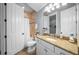 Bathroom featuring a vanity with granite countertop, toilet, tiled shower and floors at 4603 S Bartlett St, Tampa, FL 33611