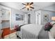 Spacious bedroom featuring a large bed, ensuite bathroom and an adjacent walk-in closet at 4603 S Bartlett St, Tampa, FL 33611