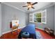 Stylish bedroom featuring a window with white shutters, providing natural light and outdoor views at 4603 S Bartlett St, Tampa, FL 33611